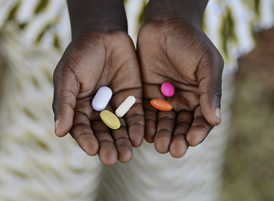 Medical advances - African Girl Holding Medicine