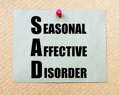 Seasonal Affective Disorder (SAD) Written On Paper Note